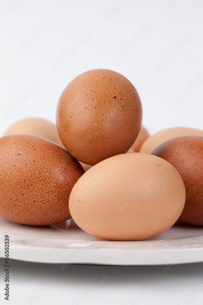 Vertical shot of platter of farm fresh brown eggs Vertical shot of platter of farm fresh brown eggs