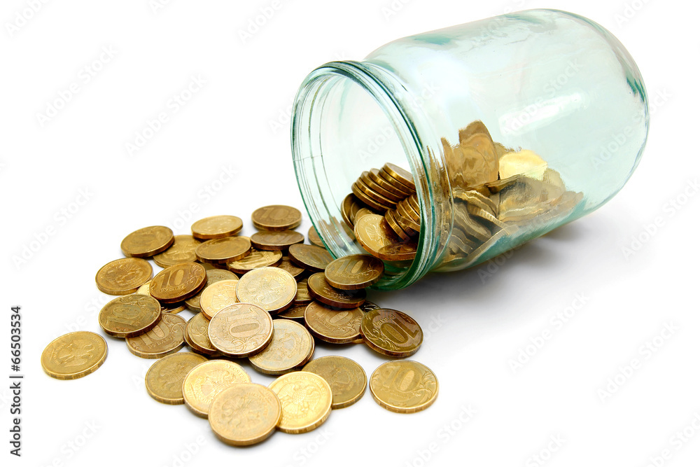 glass with gold coins. On white background. glass with gold coins. On white background.
