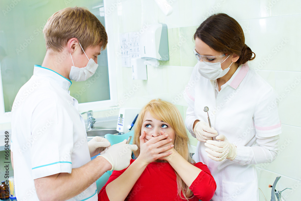 Scared patient in dentist office Scared patient in dentist office