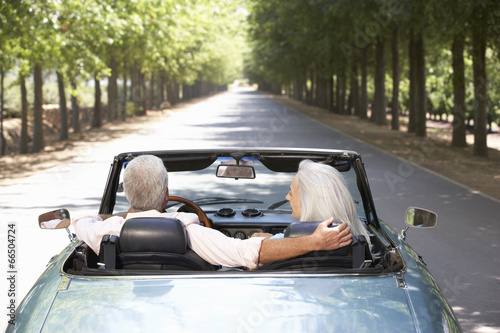 Senior couple in sports car