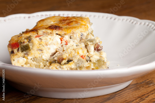 Chile Relleno Casserole on a vintage off white platter - side view