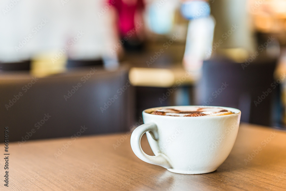 Coffee cup in coffee shop interior Coffee cup in coffee shop interior