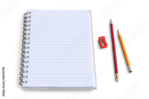Blank notepad with pencil and  sharpener on white background