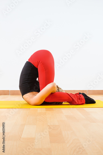 Yoga-Karnapidasana/Knee To Ear Pose photo