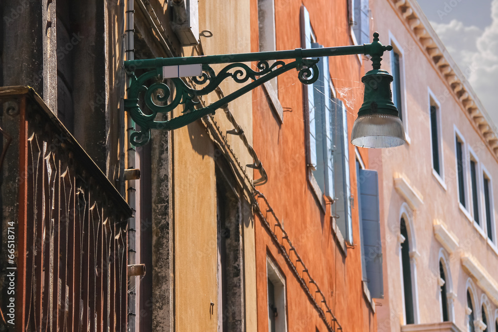 Lantern on the facade of old italian house. Venice