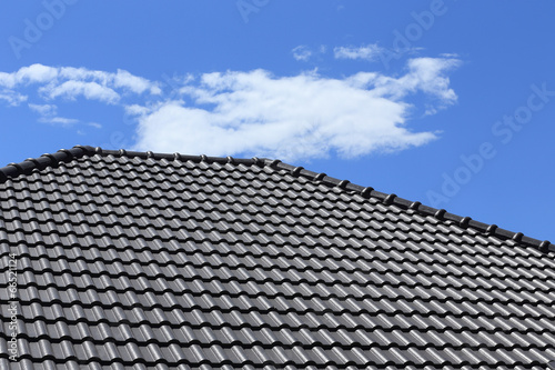 black tiles roof on a new house