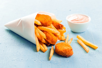 Golden fish nuggets with fried potato chips