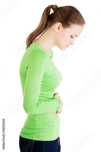 Young woman with stomach issues photo