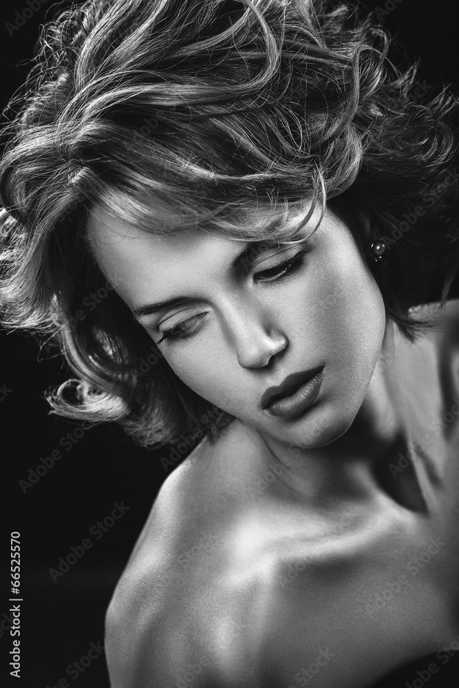 Vogue style portrait of sensual attractive curly woman