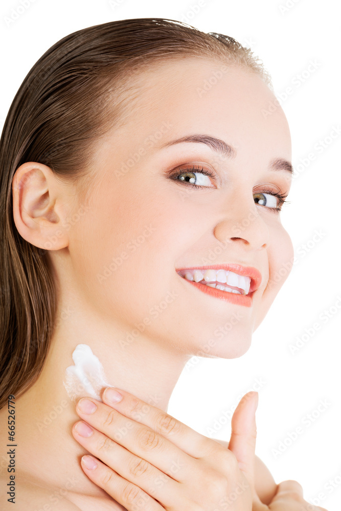 Woman with healthy skin applying cosmetic cream Woman with healthy skin applying cosmetic cream