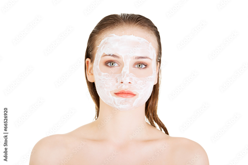 Woman with clay facial mask Woman with clay facial mask
