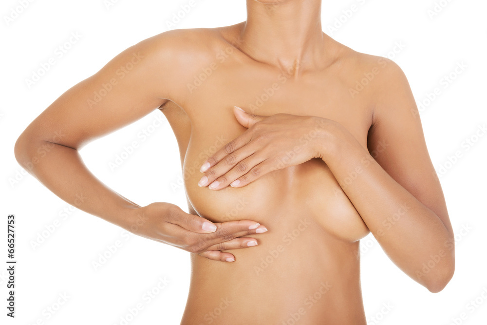 Fototapeta premium Dorosła kobieta bada piersi