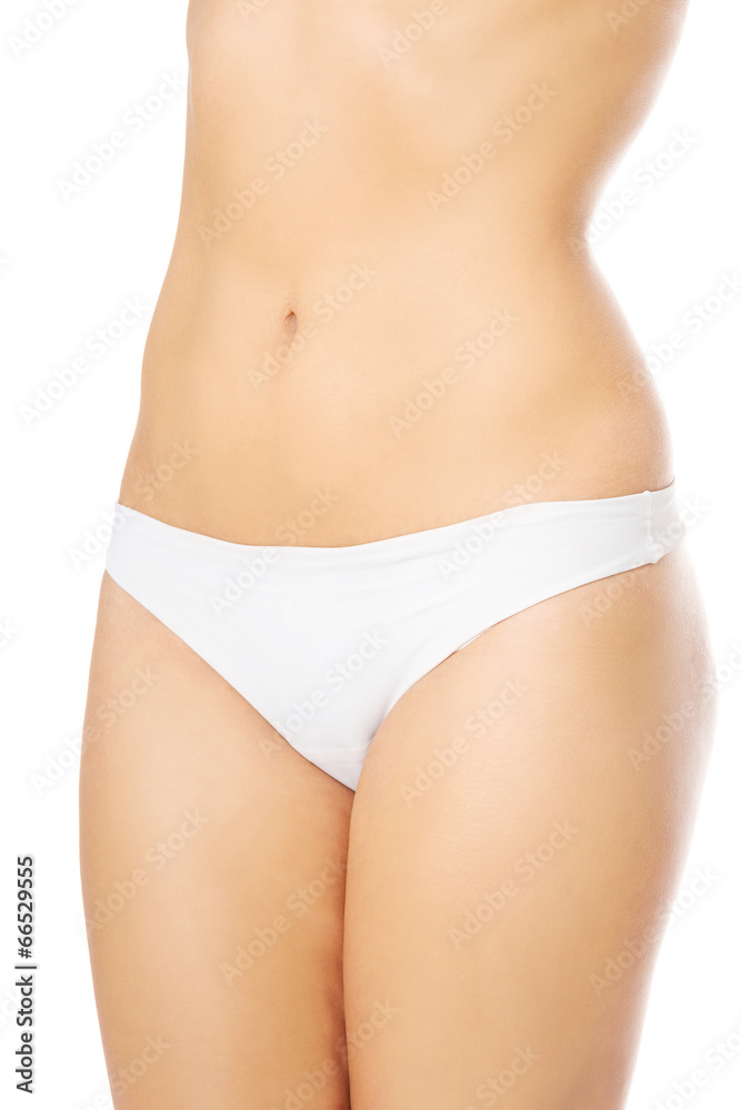 Woman in panties showin her flat belly.
