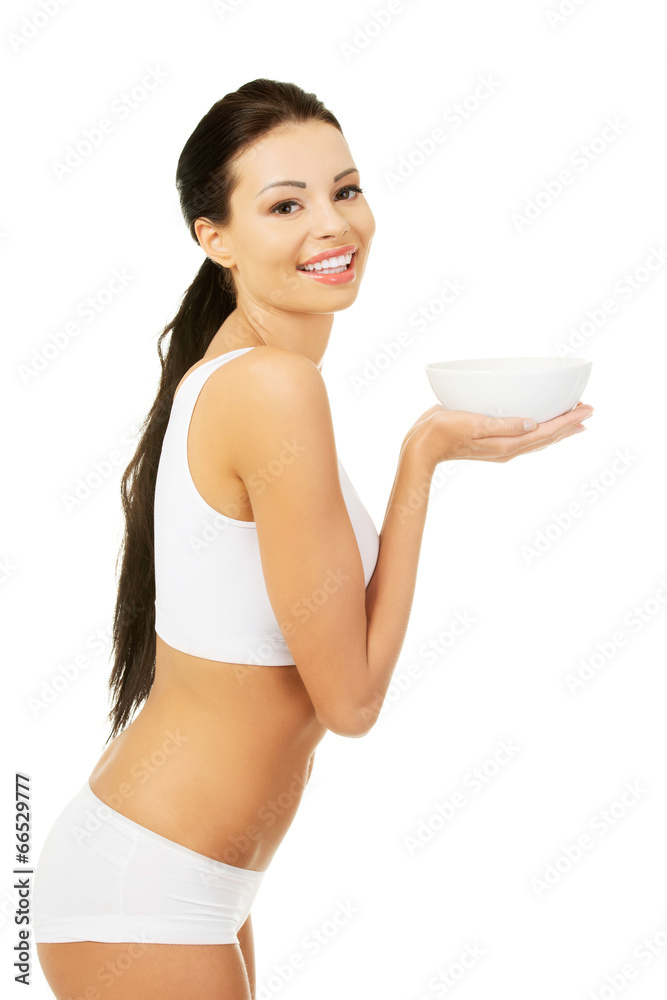 Beautiful young woman holding bowl Beautiful young woman holding bowl