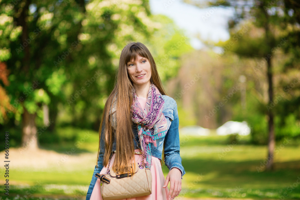 Happy positive girl outdoors on a summer day