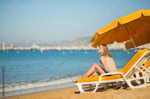 Beautiful girl relaxing on a beach chair
