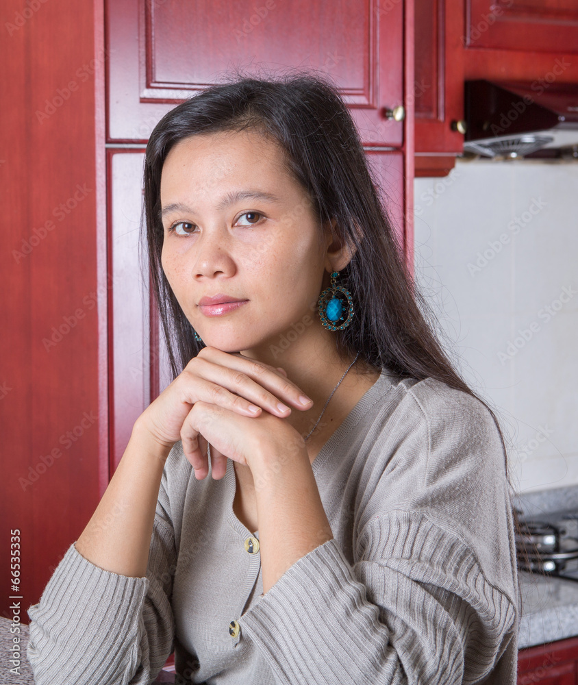 Asian female in the kitchen Asian female in the kitchen