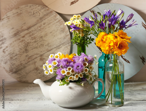 Fototapeta Naklejka Na Ścianę i Meble -  Kitchen decoration with teapot and wild flowers