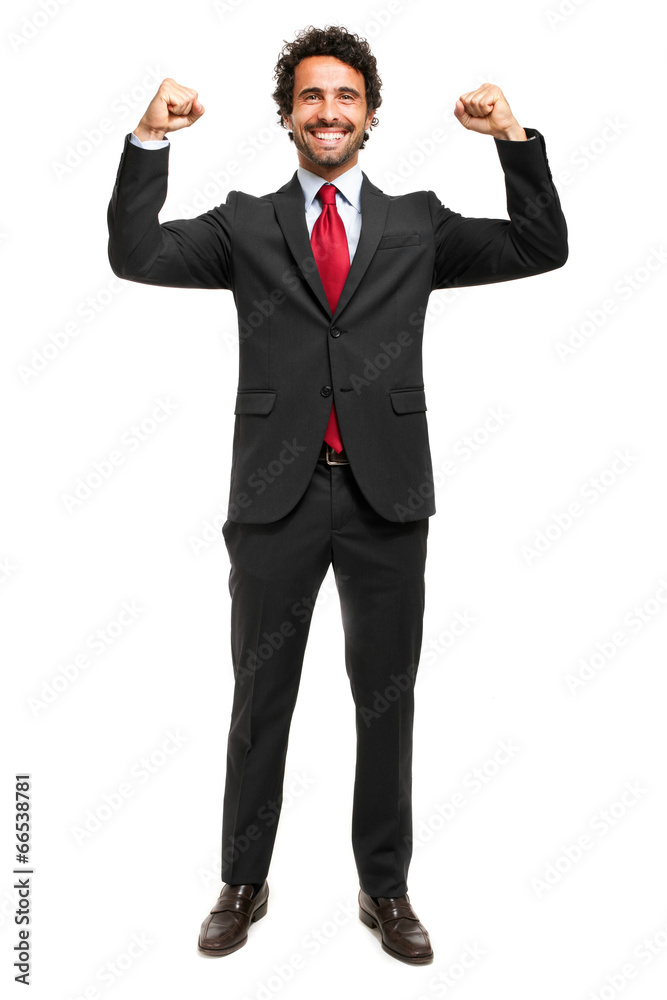 Handsome manager raising arms in sign of victory Handsome manager raising arms in sign of victory