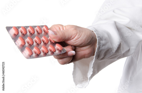 Nurse holding a blister pack with pills