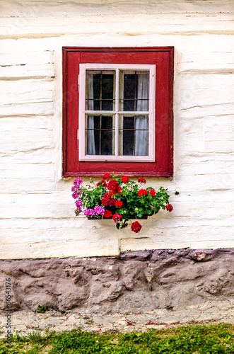 Detail of colorful window on old traditional house #66543176