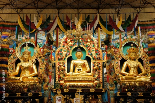 Buddha statues in a Tibetan monastery photo