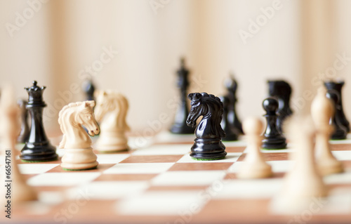 Chess pieces set on a chessboard