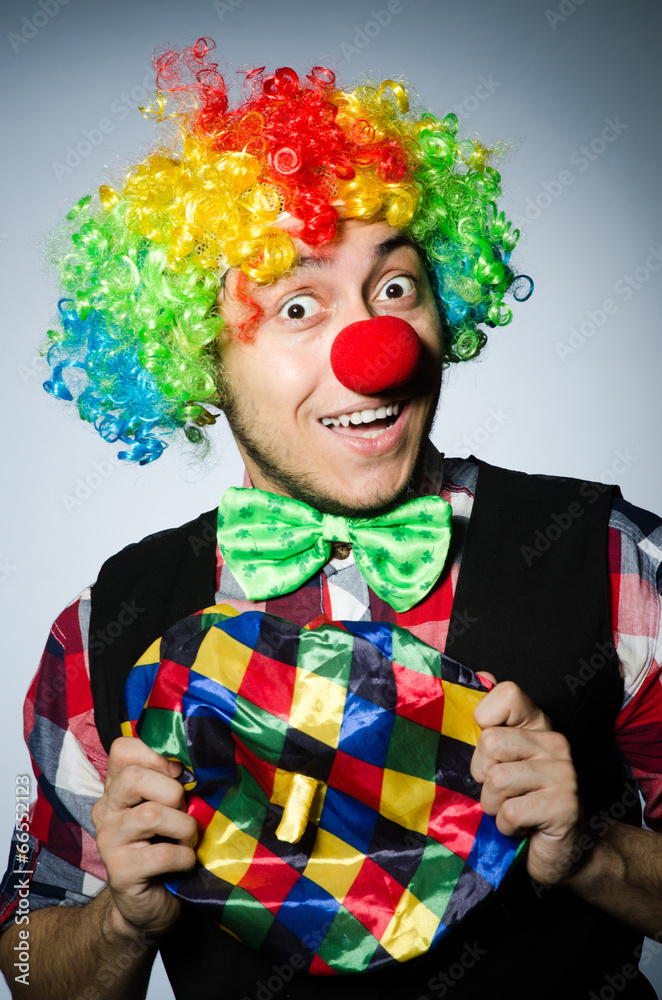Funny clown against the dark background Funny clown against the dark background