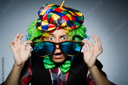 Funny clown against the dark background