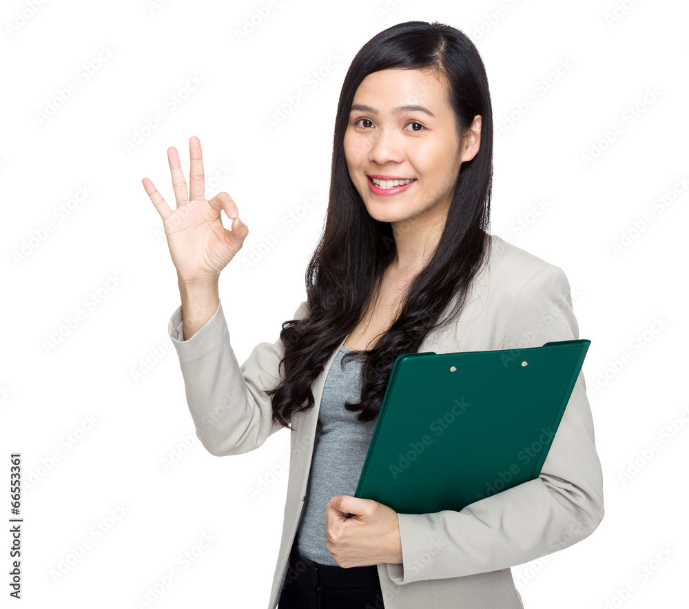 Woman with clipboard and show ok sign Woman with clipboard and show ok sign
