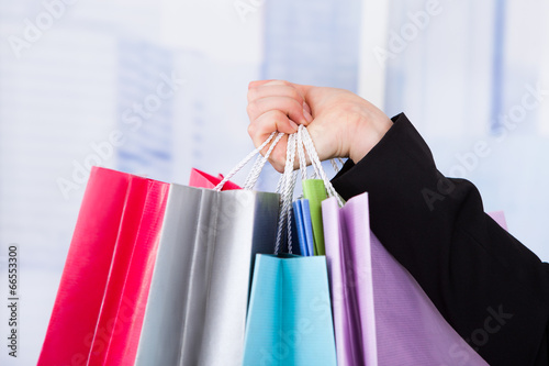 Businesswoman Carrying Shopping Bags