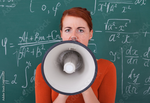 Student Screaming On Megaphone Against Blackboard photo