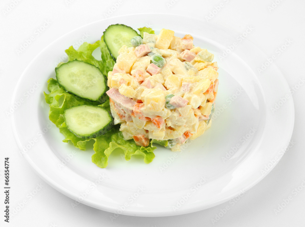 Russian traditional salad Olivier, isolated on white Russian traditional salad Olivier, isolated on white