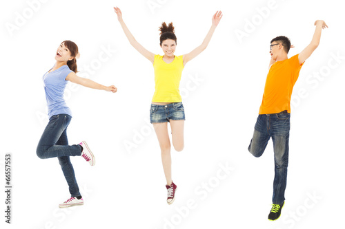 happy young people dancing and jumping