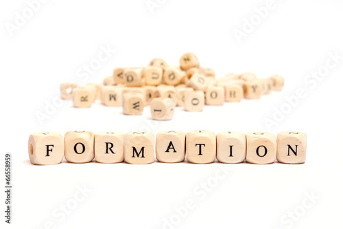 word with dice on white background- formation photo