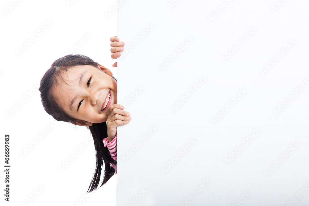 Asian little girl peeking  behind empty billboard