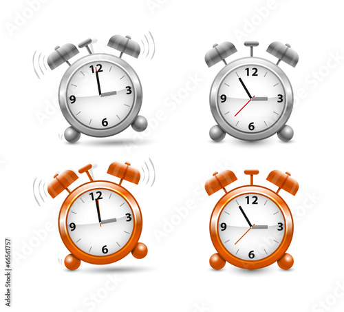 Silver and orange alarm clocks