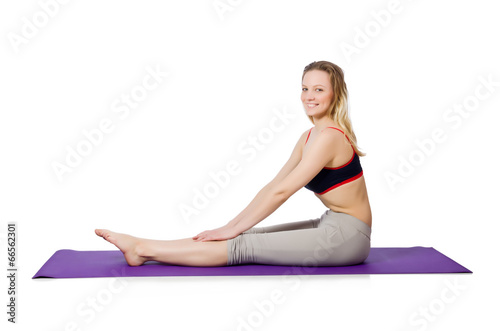 Young female doing exercises on white