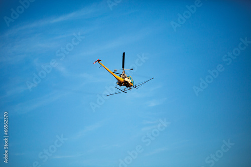 Fototapeta Naklejka Na Ścianę i Meble -  Crop sprayer duster helicopter, spraying mountains, fields and l