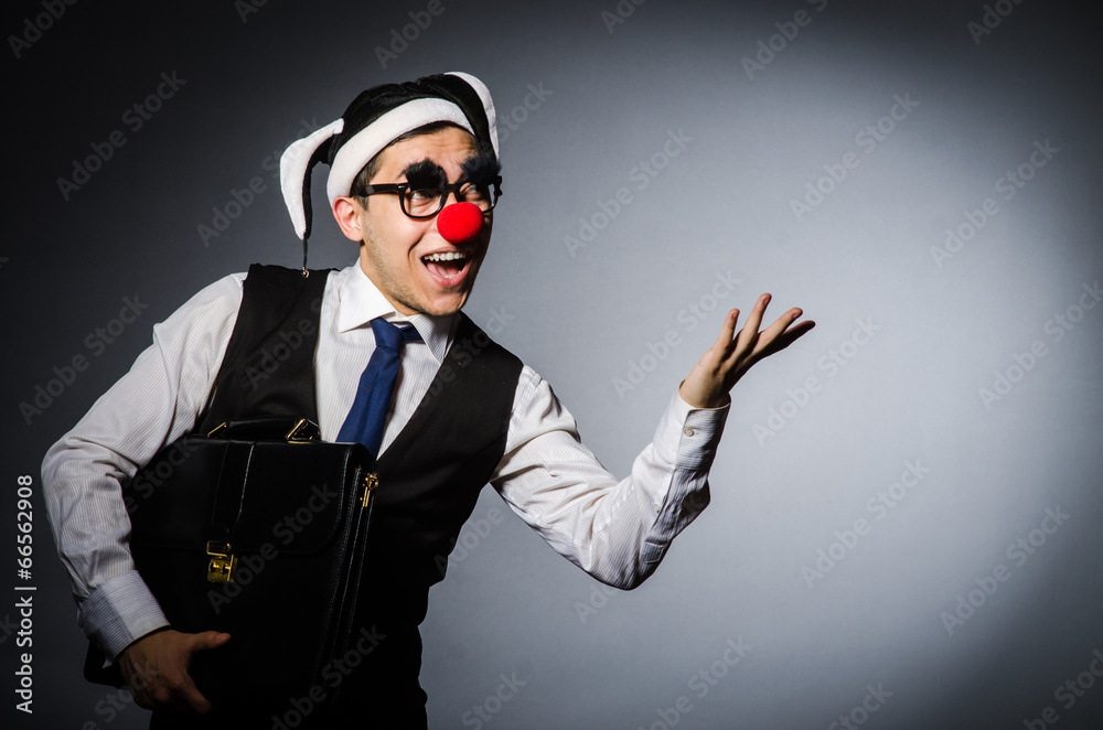 Clown businessman in funny concept Clown businessman in funny concept