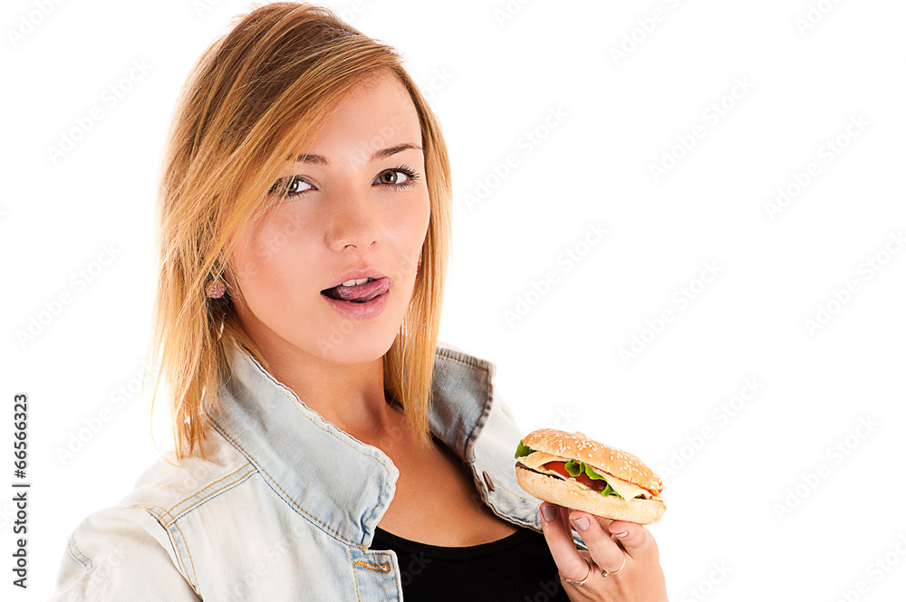 beautiful girl licking lips holding a hamburger in hand beautiful girl licking lips holding a hamburger in hand