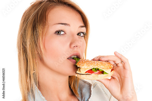 young woman eating a hamburger