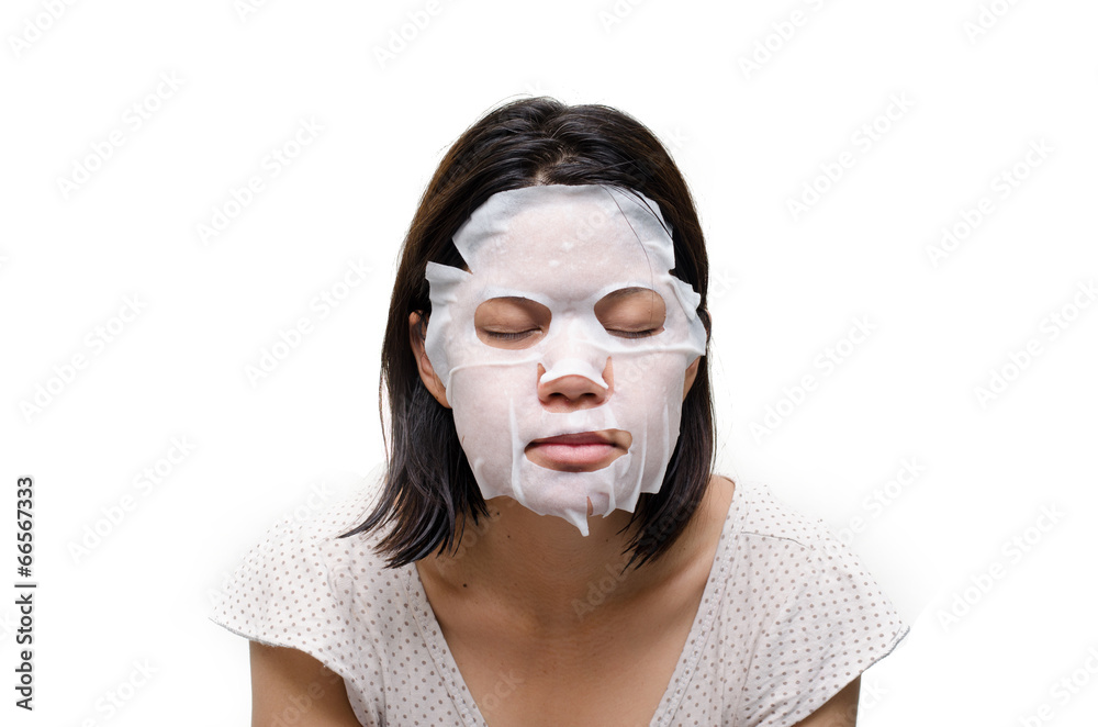 Woman using  facial mask
