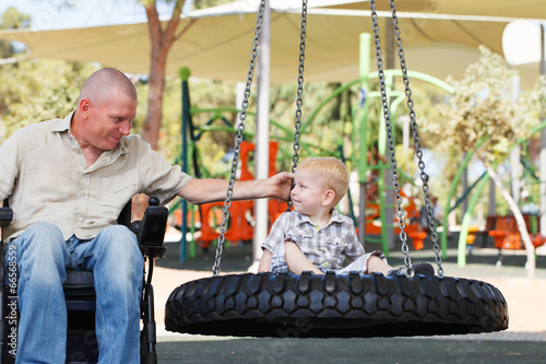 Dad play with son outdoor at park