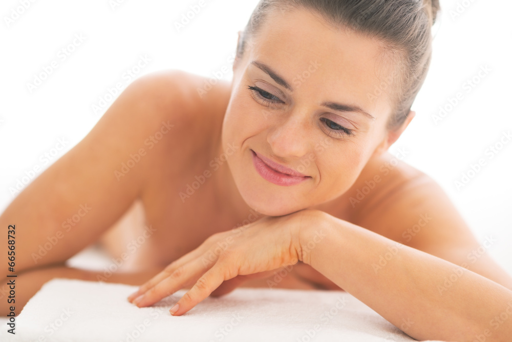 Portrait of relaxed young woman laying on massage table Portrait of relaxed young woman laying on massage table