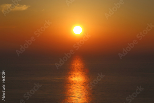 Golden sunset with reflection on the sea