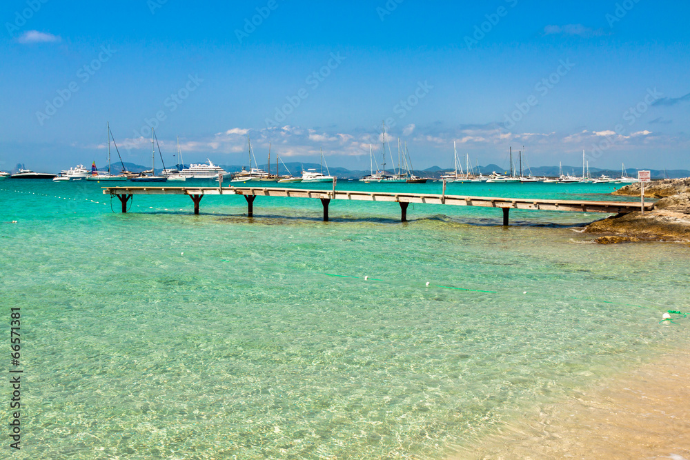 Formentera tropical Mediterranean sea wooden pier in Illetes bea