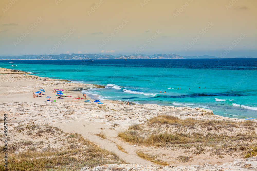 Tourists in Illetes beach Formentera island, Mediterranean sea, Tourists in Illetes beach Formentera island, Mediterranean sea,
