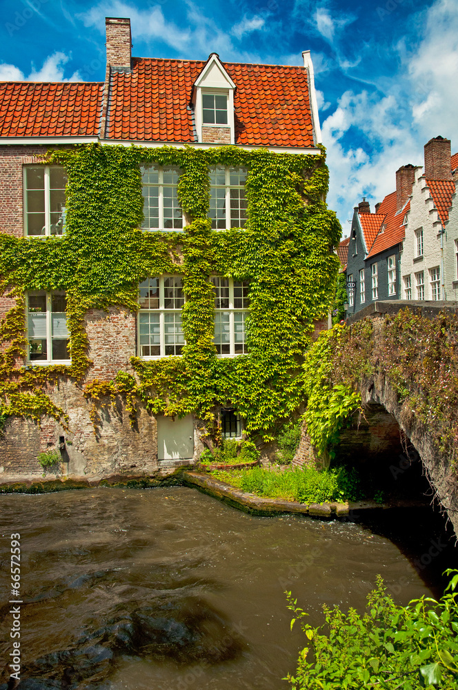 Naklejka premium Houses along the canals of Brugge or Bruges, Belgium