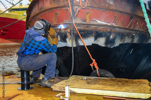Welder at work in the shipyard